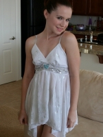 Cute girl next door Anna shows off her tight perky body in a sparkly little white dress