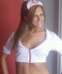 Adri dresses up as a naughty nurse with white fishnets