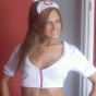 Adri dresses up as a naughty nurse with white fishnets