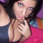 Nikki takes pictures of herself in a black tiny bra which her tits are almost falling out of