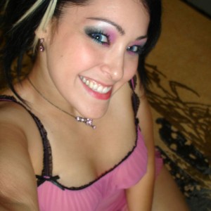 Kitty takes self pictures of her in a cute pink nighty