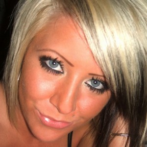 Monroe shows off her amazing stunning blue eyes as she strips and gets messy with chocolate sauce