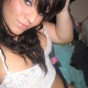 Cute teen takes self pictures of herself in and out of her little lace top