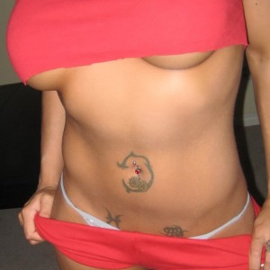 Zoes huge tits are barely covered by her ripped tshirt
