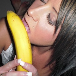 Sexy Monroe shows off her oral skills on a banana and then strips naked