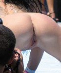 Stripper on outdoor stage shows her tight pussy to the crowd