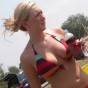 Candid pictures of busty girls at the beach in bikinis