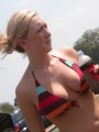 Candid pictures of busty girls at the beach in bikinis