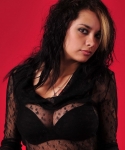 Nicole teases with her big tits in a sexy black bra with a sheer top over them 